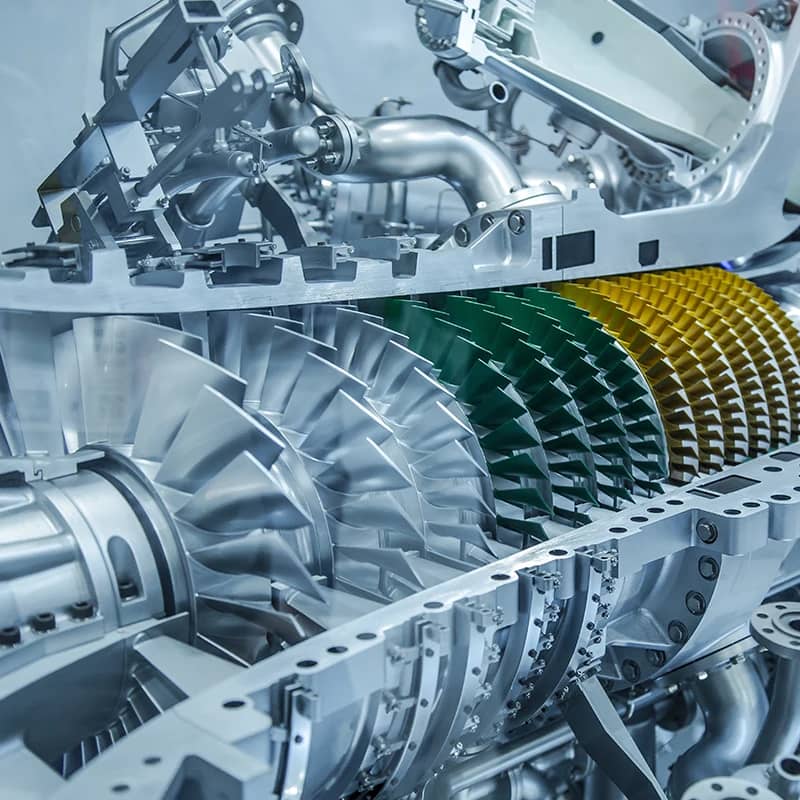 Close-up of a jet engine's intricate internal turbine blades and components.