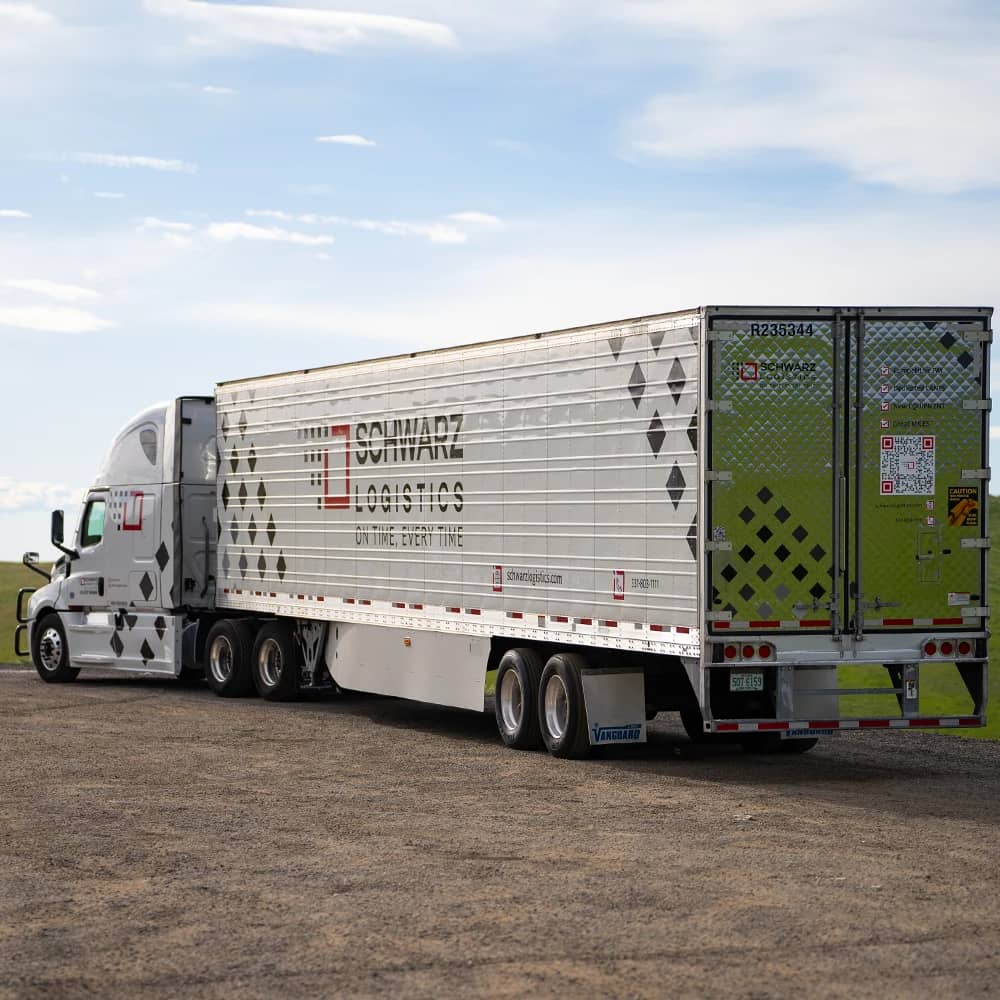 A semi-trailer truck with "Schwarz Logistics" branding on the trailer.