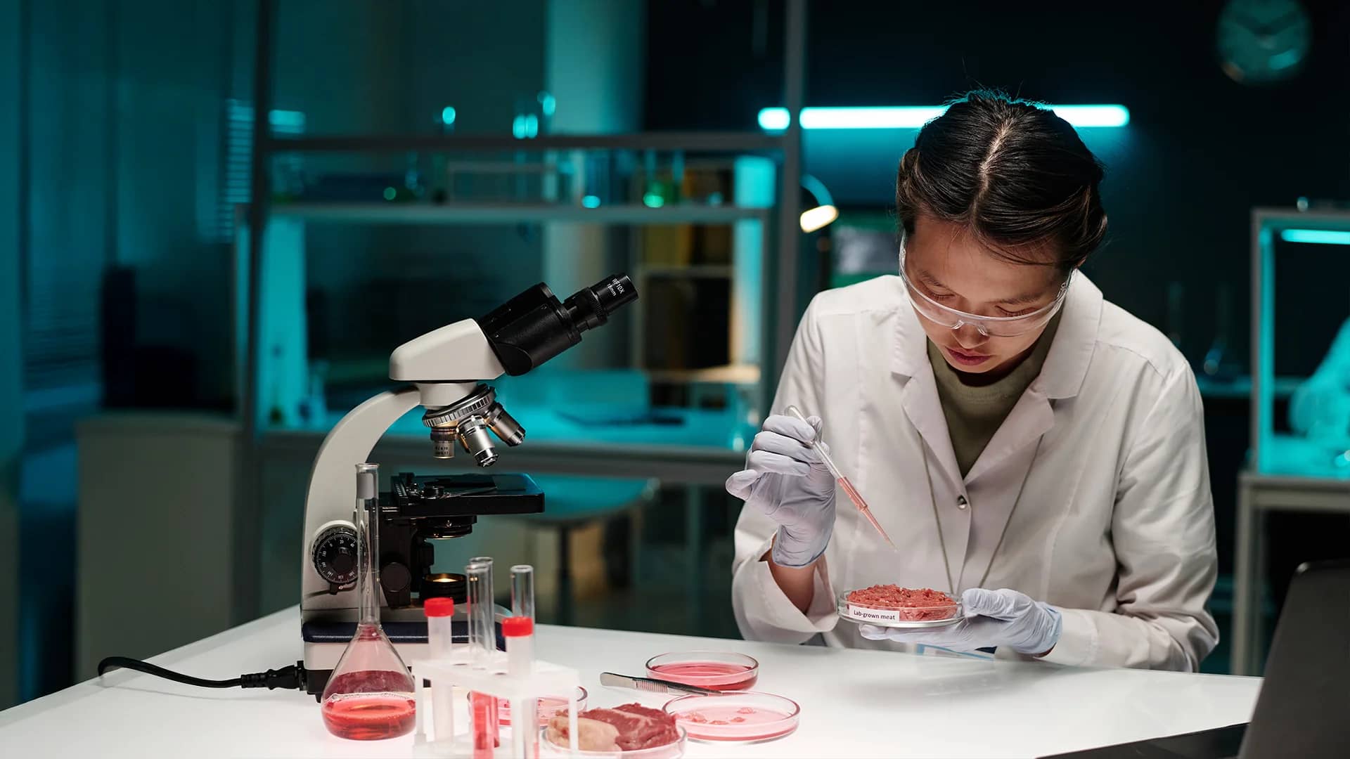 A female researcher doing tests on meat.