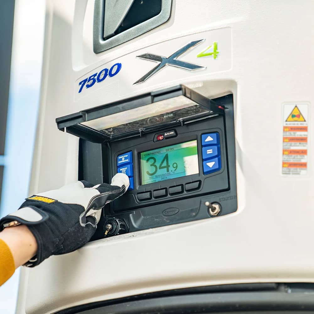 a driver sets temperature on refer unit
