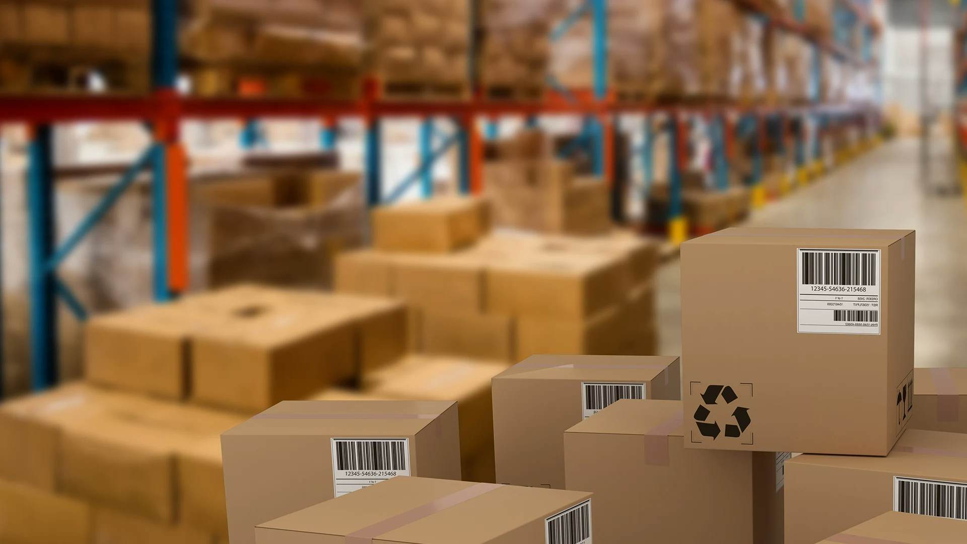 Cardboard boxes with barcodes in a warehouse.