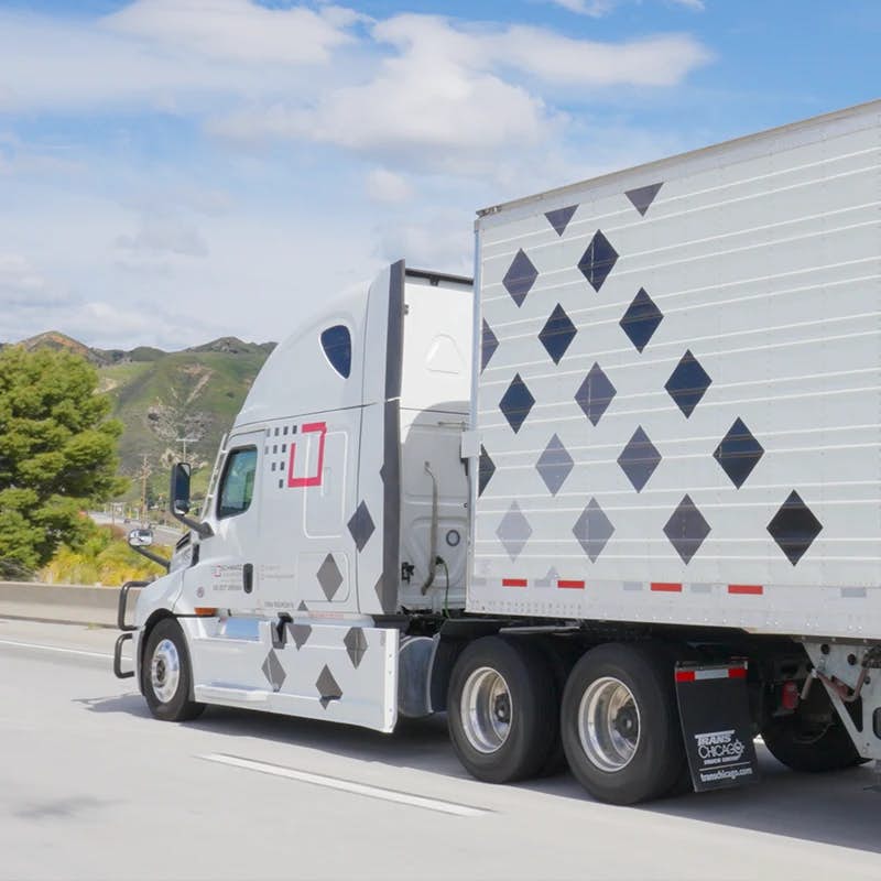 Schwarz Logistics truck driving on a highway.