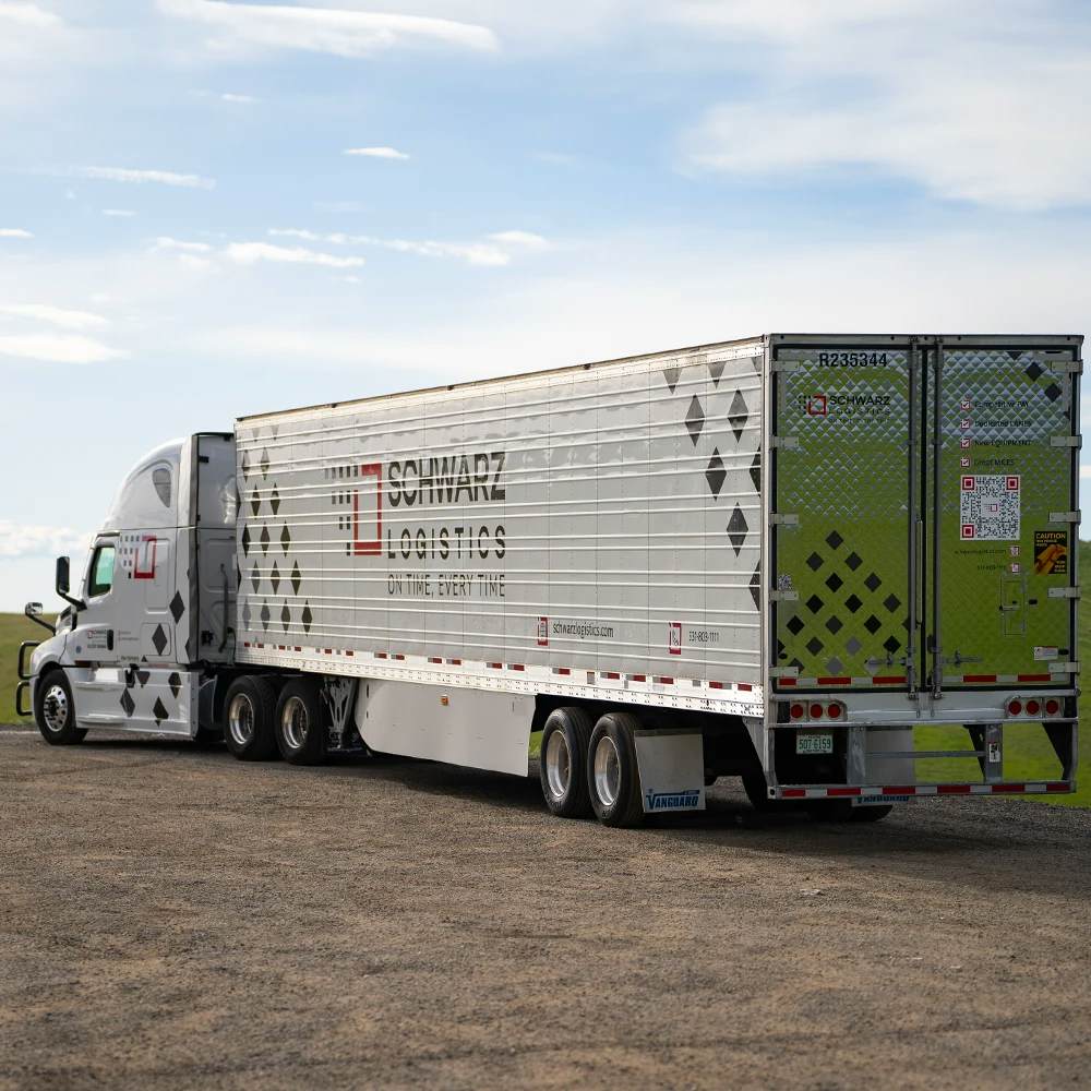 A semi-trailer truck with "Schwarz Logistics" branding on the trailer.